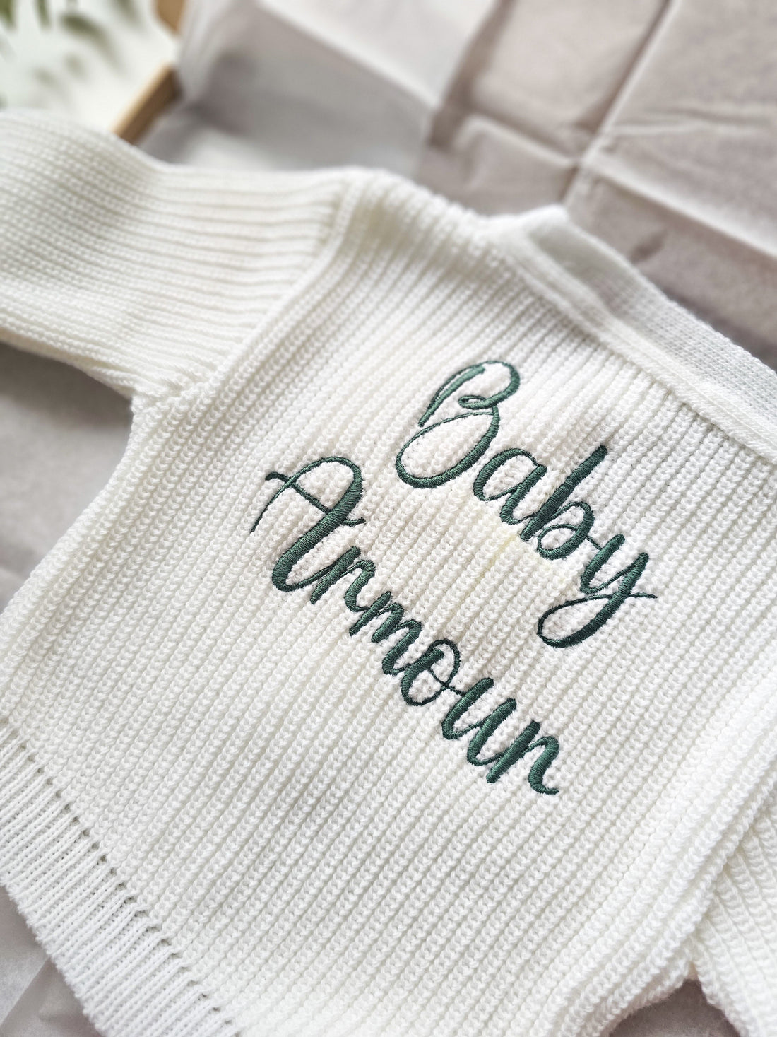 knitted white baby cardigan embroidered with baby's name