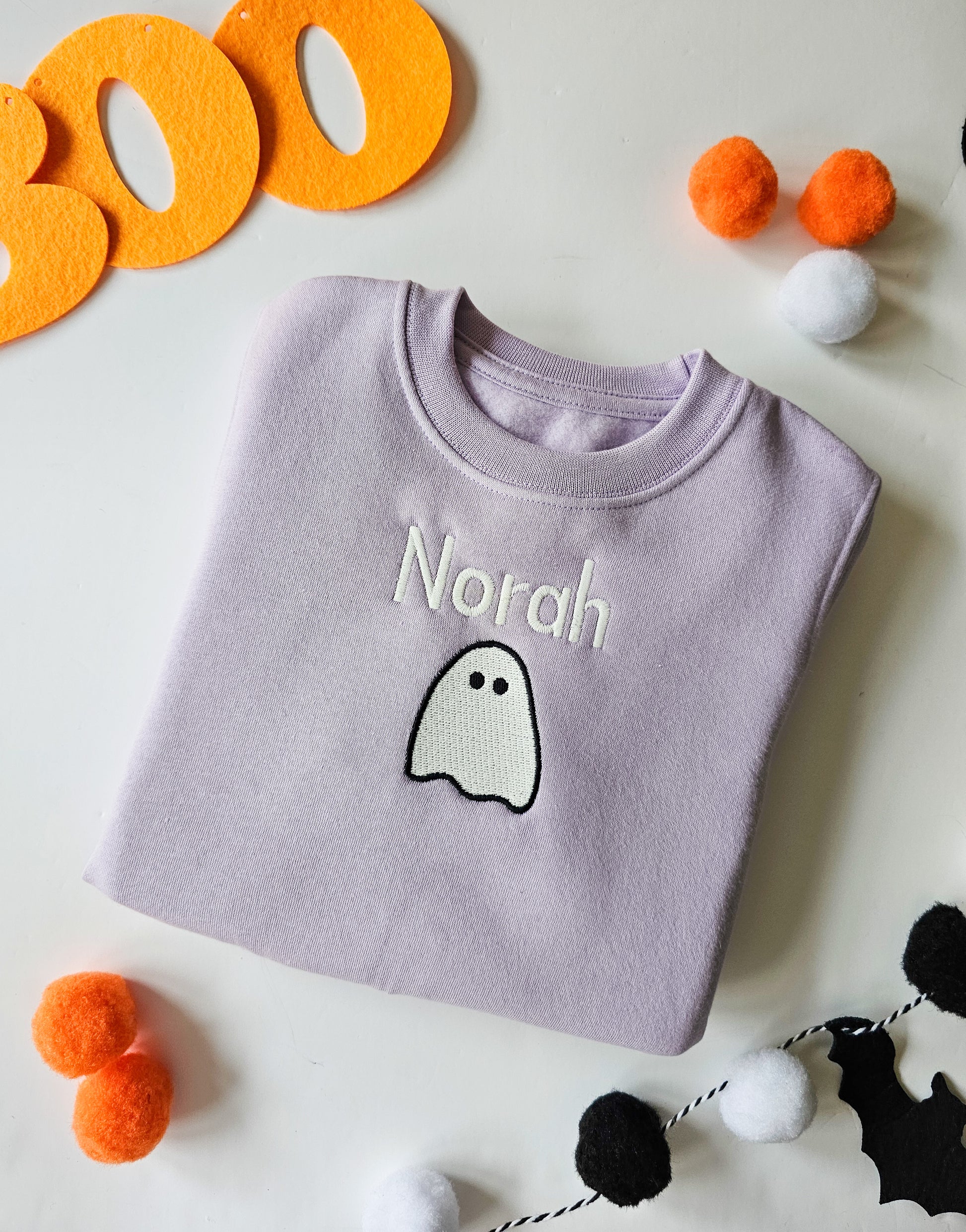 Lilac Halloween jumper embroidered with glow in the dark ghost and personalised with childs name.