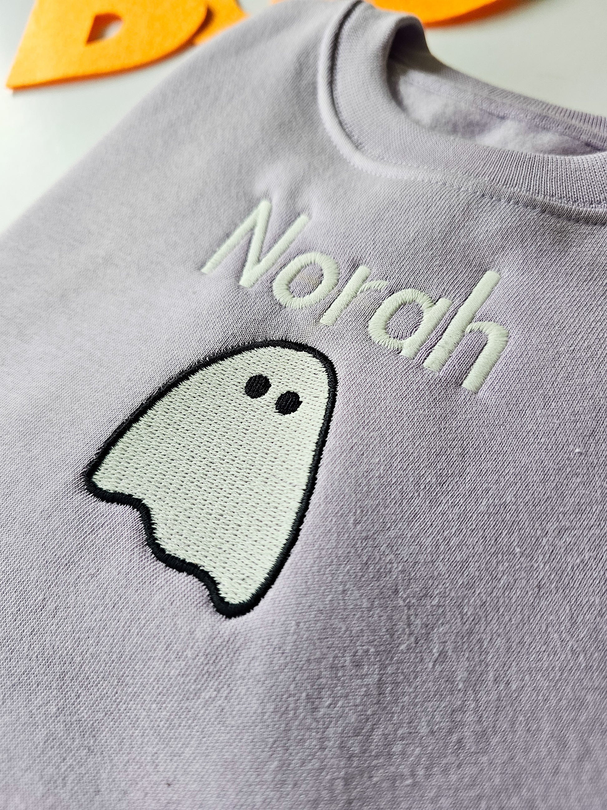Lilac Halloween jumper embroidered with glow in the dark ghost and personalised with childs name.