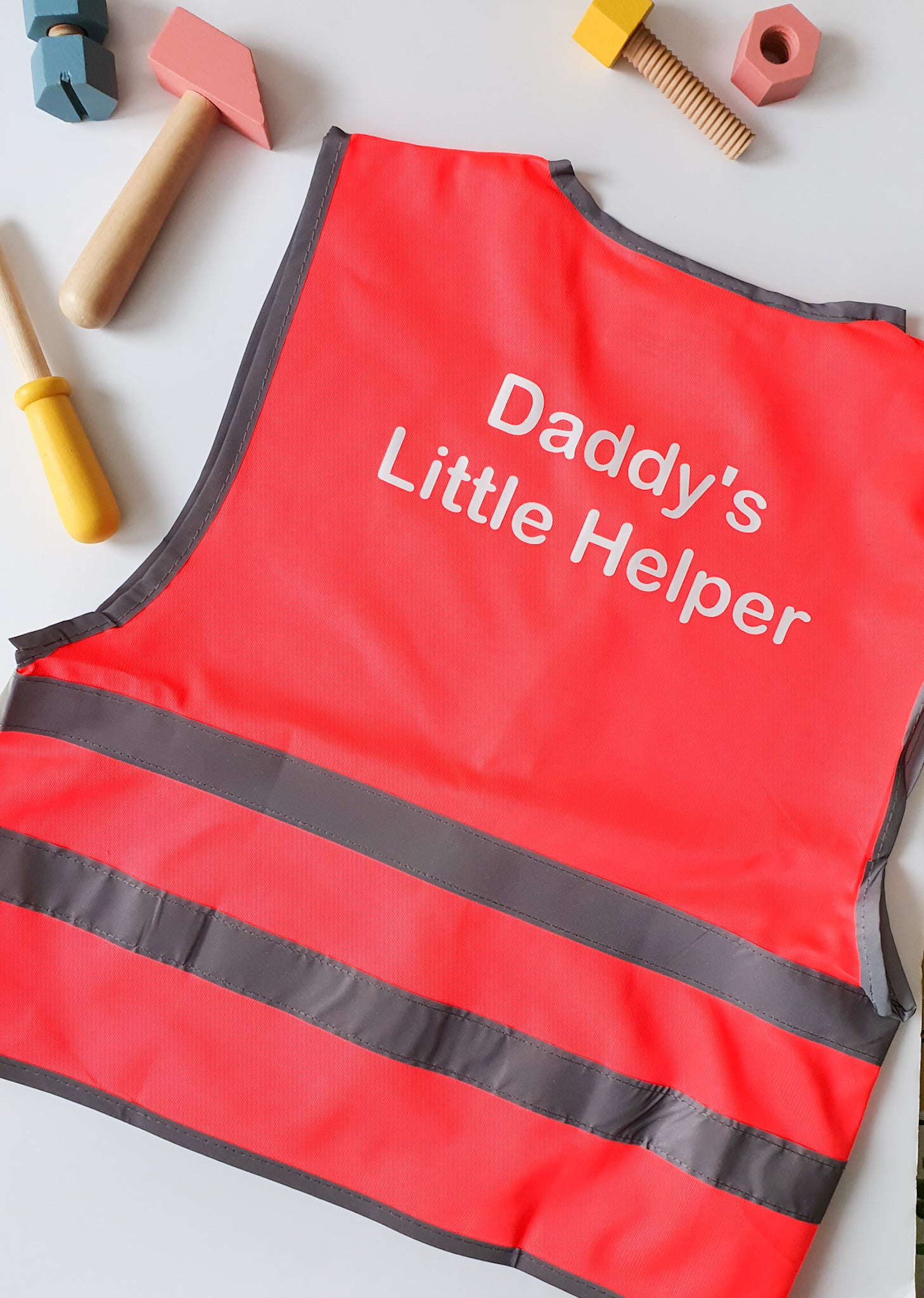 Pink childrens Hi-Vis role play vest printed daddys little helper on the back