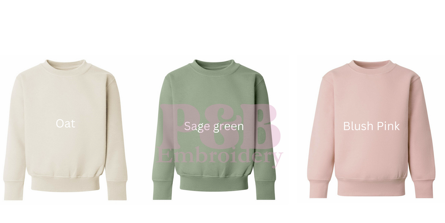 Three sweatshirts in oat, sage green, and blush pink on a white background.