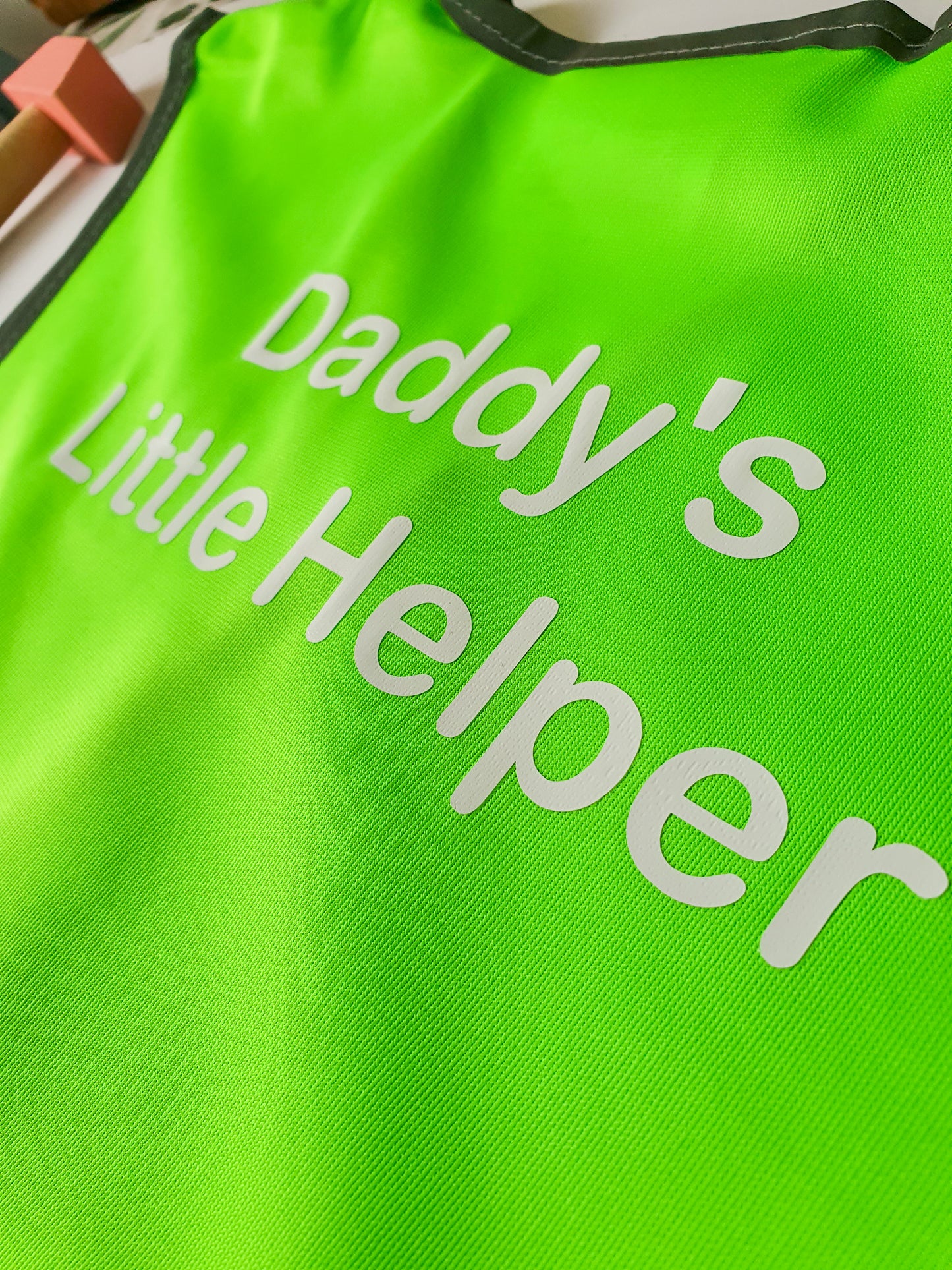 Close up of childrens hi vis vest printed Daddys little helper