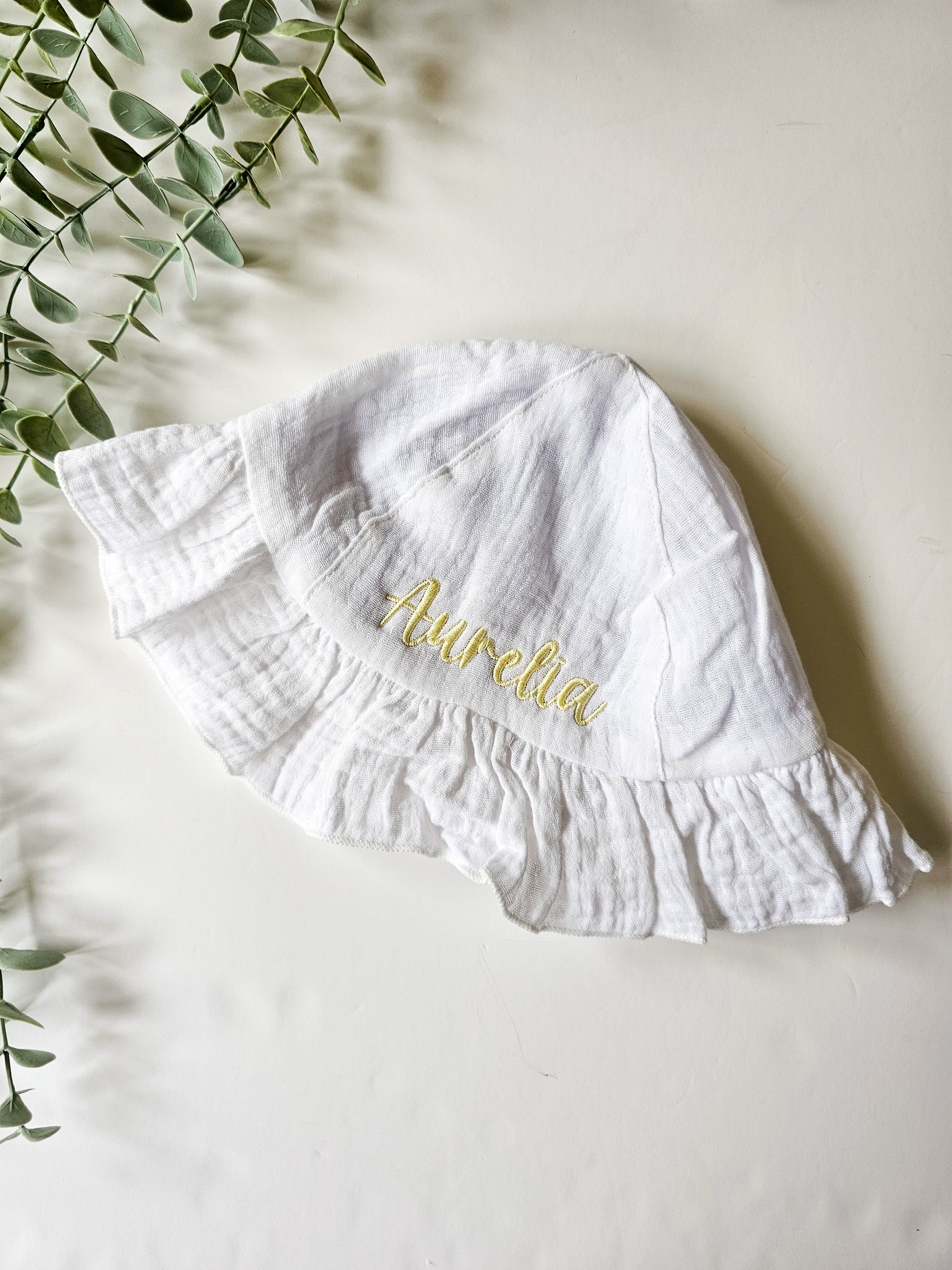 Personalised embroidered baby sun hat, with yellow thread