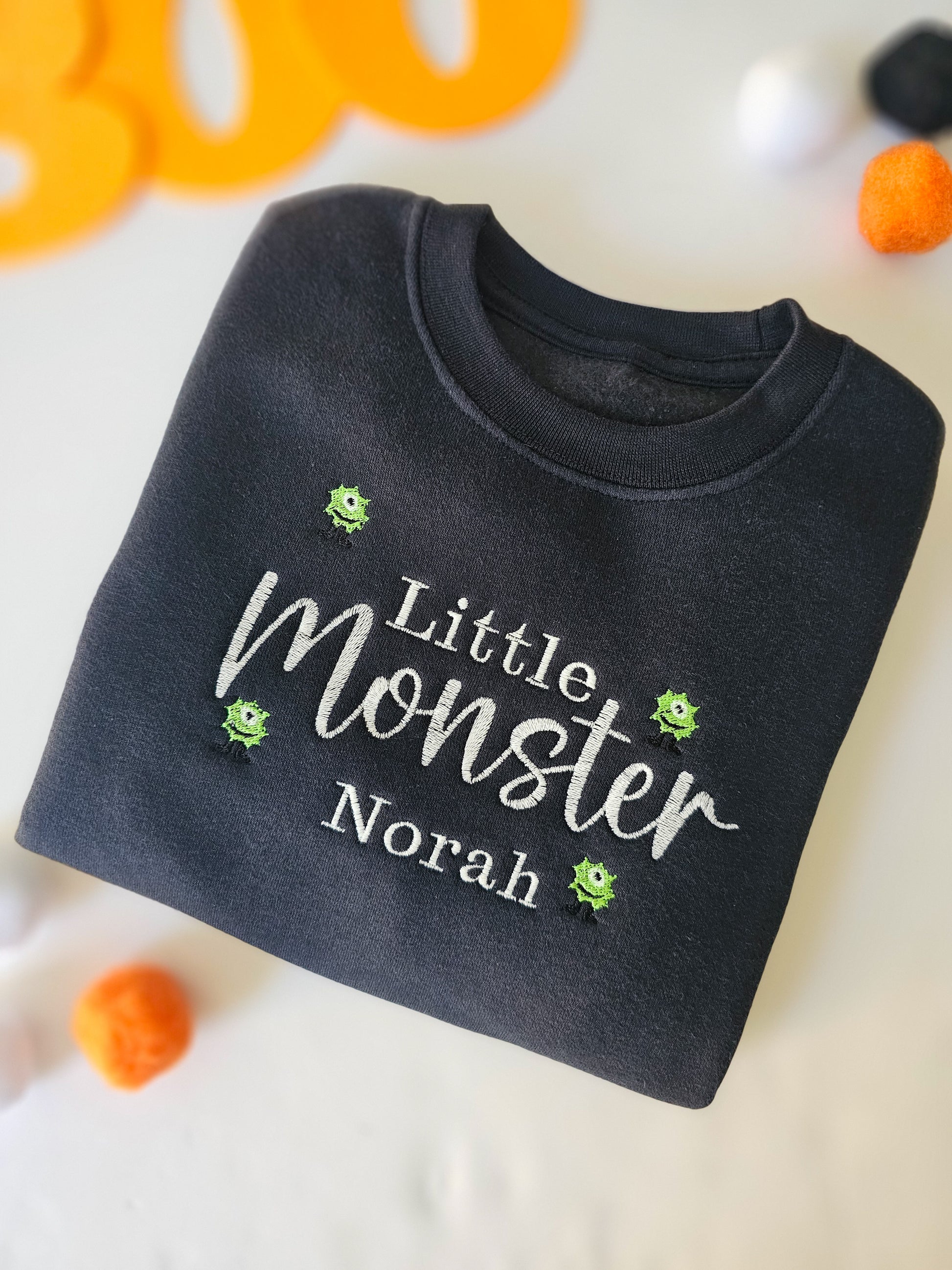 black jumper personalised embroidered with childs name and monsters