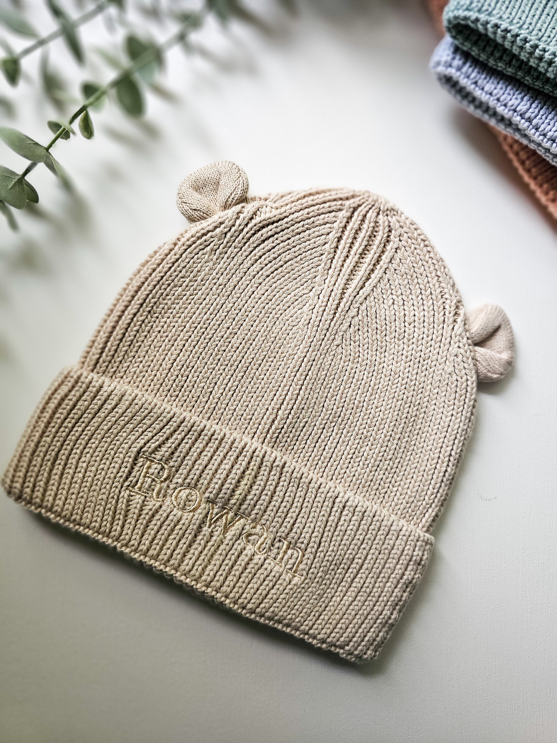 Beige ribbed knit baby beanie with 3D bear ear. Personalised with child's name in embroidery.