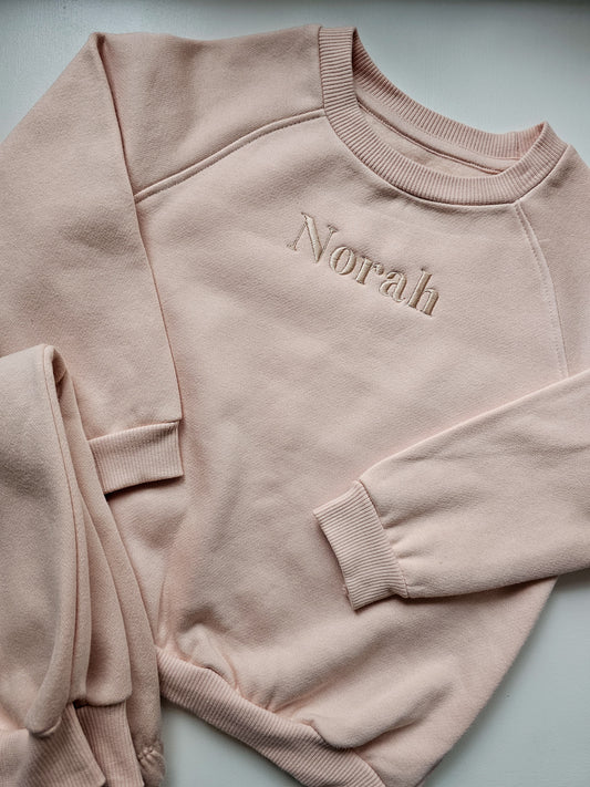 Personalised children’s lounge wear set embroidered with child’s name, available in blush pink, oat and sage green.